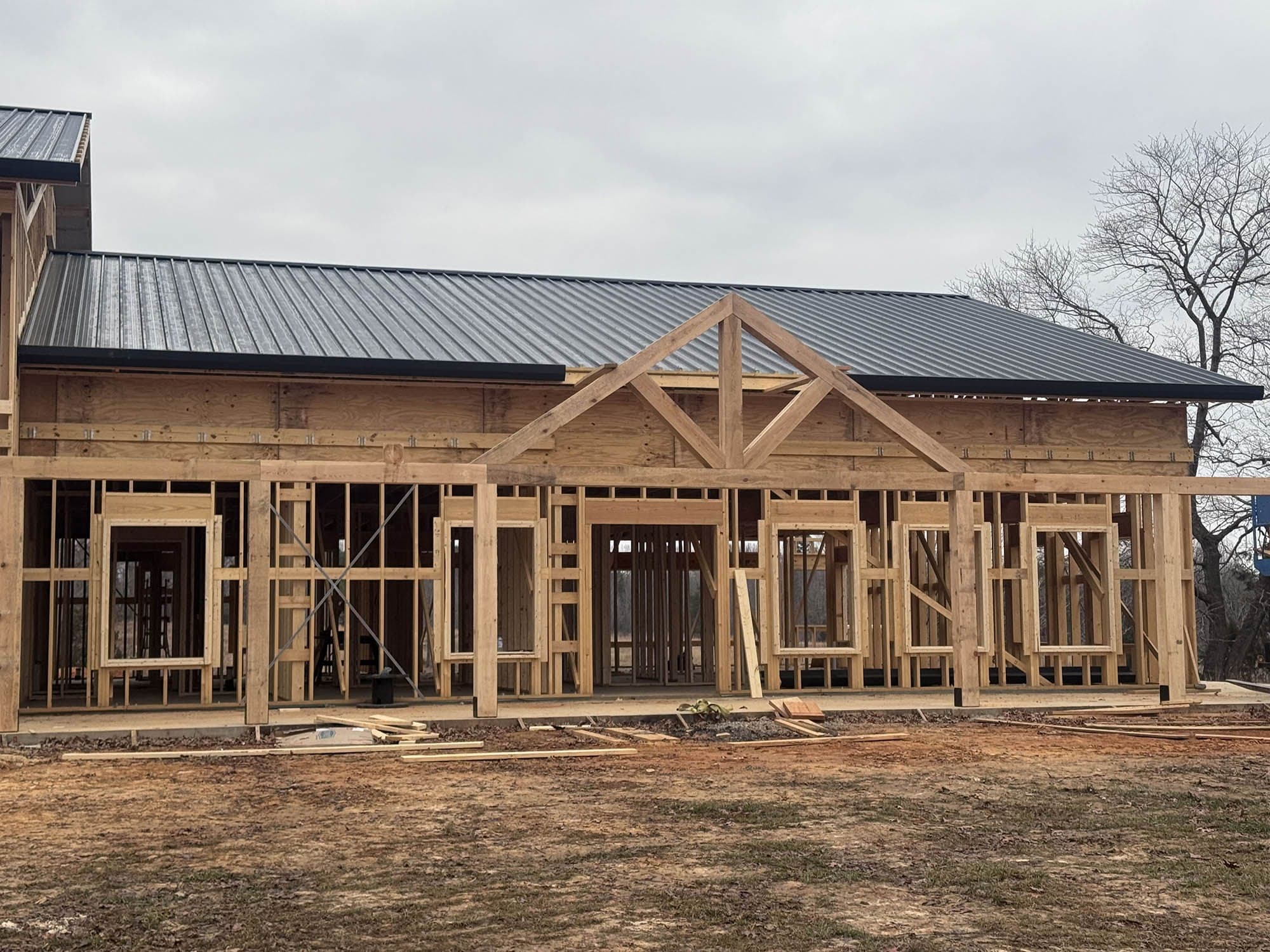 Timber-framed building with a standing-seam metal roof installed, South Boston, Virginia
